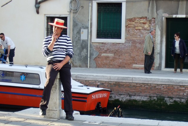 Venice gondolier taking a smoke break Photo by MARGIE MIKLAS